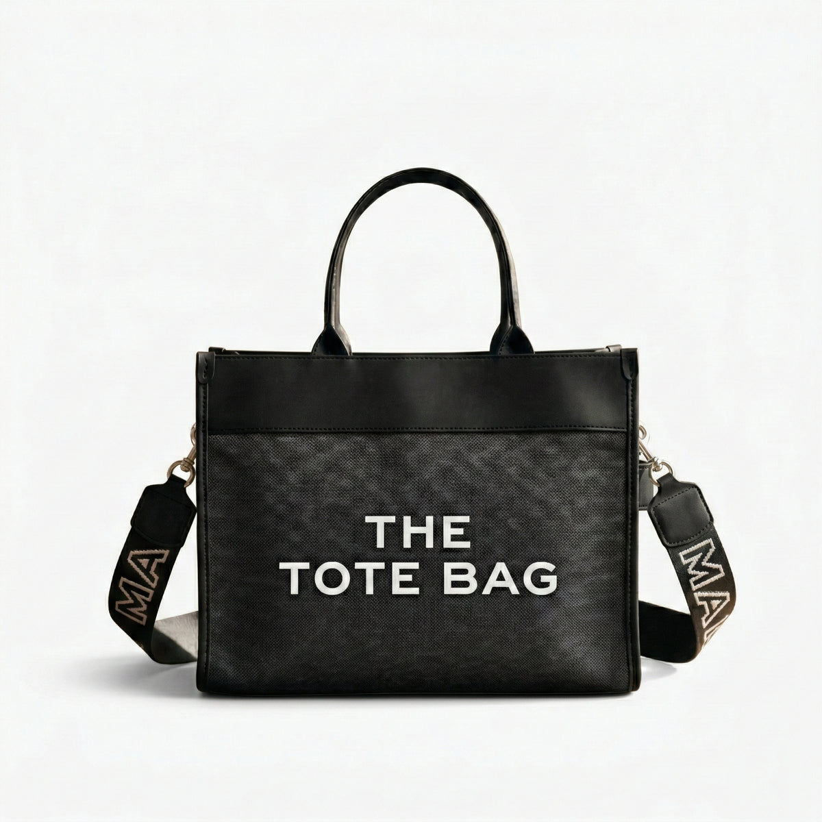 The Iconic Canvas Tote Bag | شنطة توت كانفاس بتفاصيل جلد