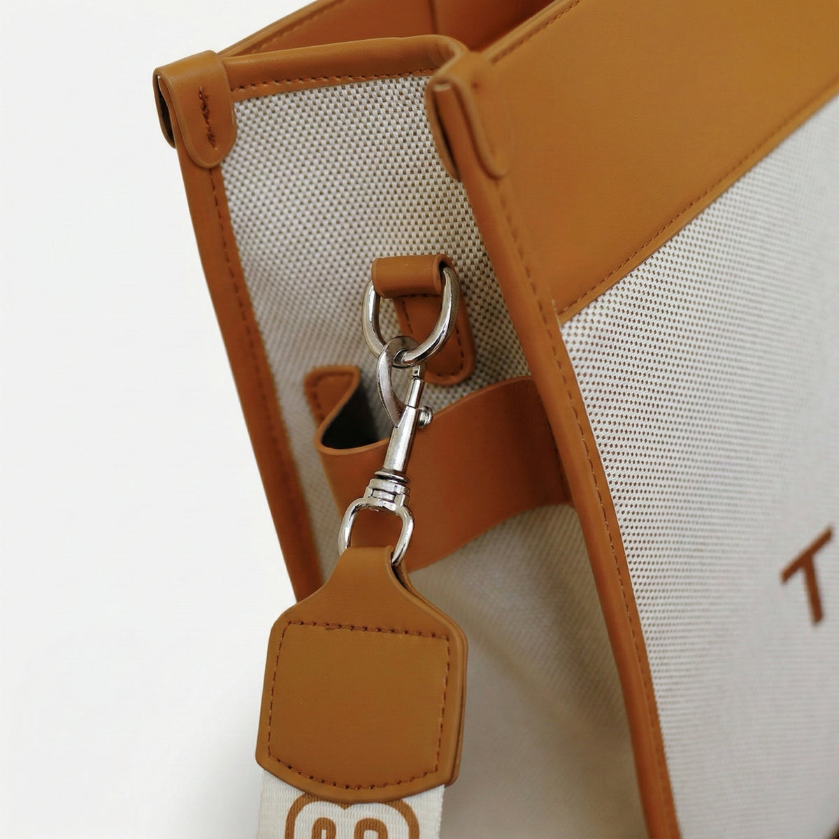 The Iconic Canvas Tote Bag | شنطة توت كانفاس بتفاصيل جلد