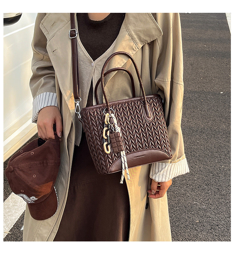 شنطة جلد مجدول بميدالية شوكولاتة-Leather Bag with Chocolate Charm