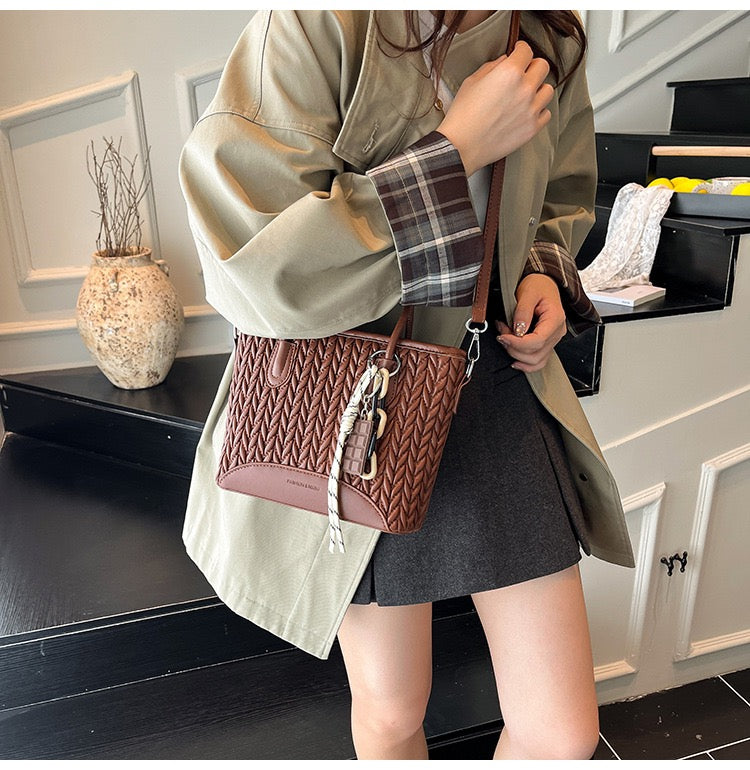 شنطة جلد مجدول بميدالية شوكولاتة-Leather Bag with Chocolate Charm