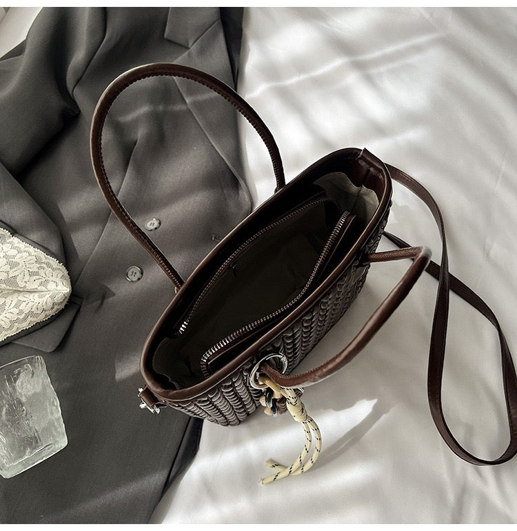 شنطة جلد مجدول بميدالية شوكولاتة-Leather Bag with Chocolate Charm